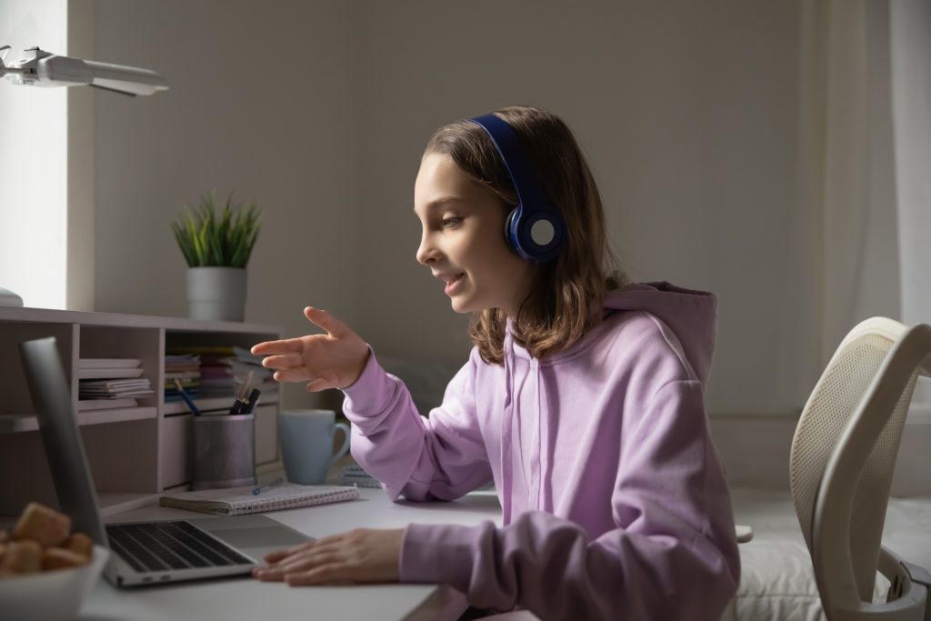 Teenager using a laptop